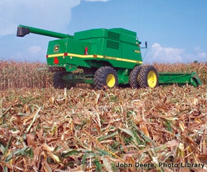 Photo: Tractor harvesting corn